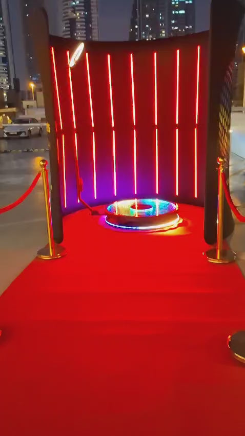 LED Backdrop rental with vibrant lights and red carpet for modern events.